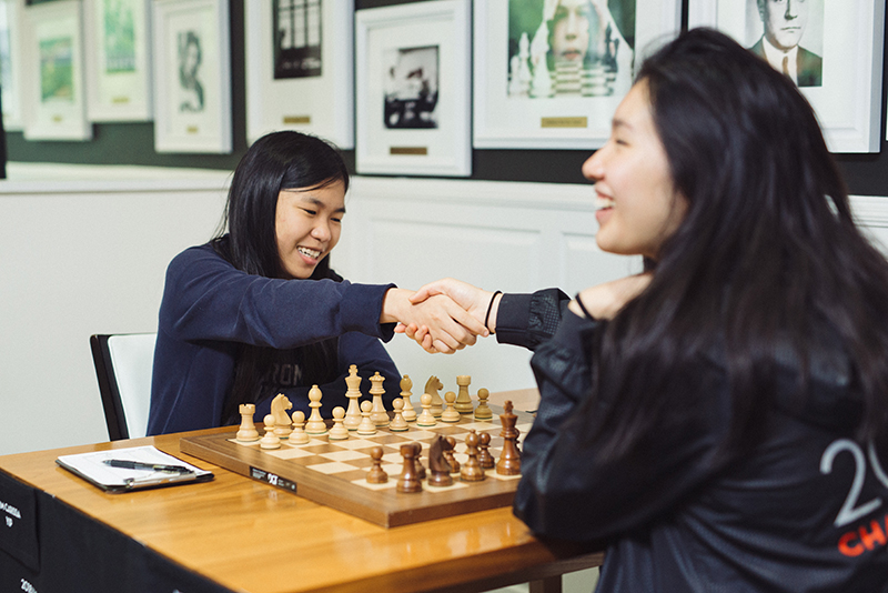 Carissa Yip and Jennifer Yu Shake Hands before Round 9 of the 2018 Girls’ Junior Chess Championship