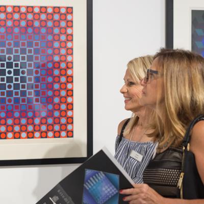 Guests view the exhibition Victor Vasarely: Calculated Compositions at the World Chess Hall of Fame
