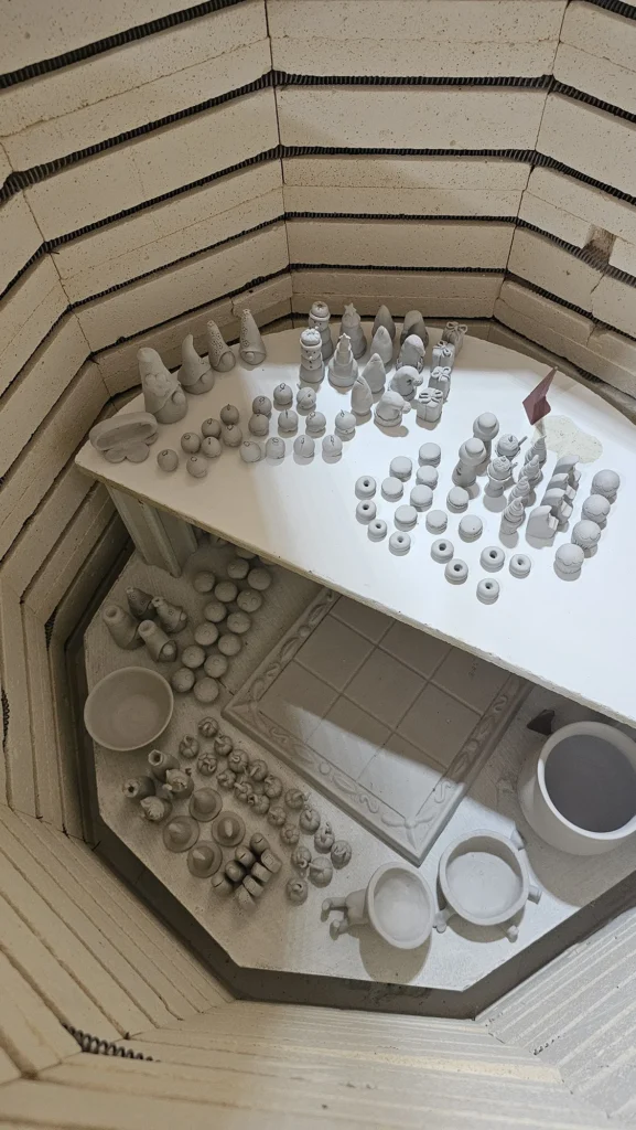 Chess Pieces in the Kiln Before Firing