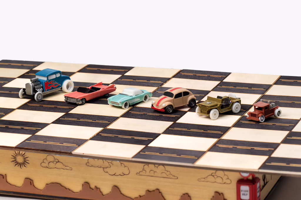 Detailed view of the car pieces from the Route 66 chess set, representing different classic vehicle models.