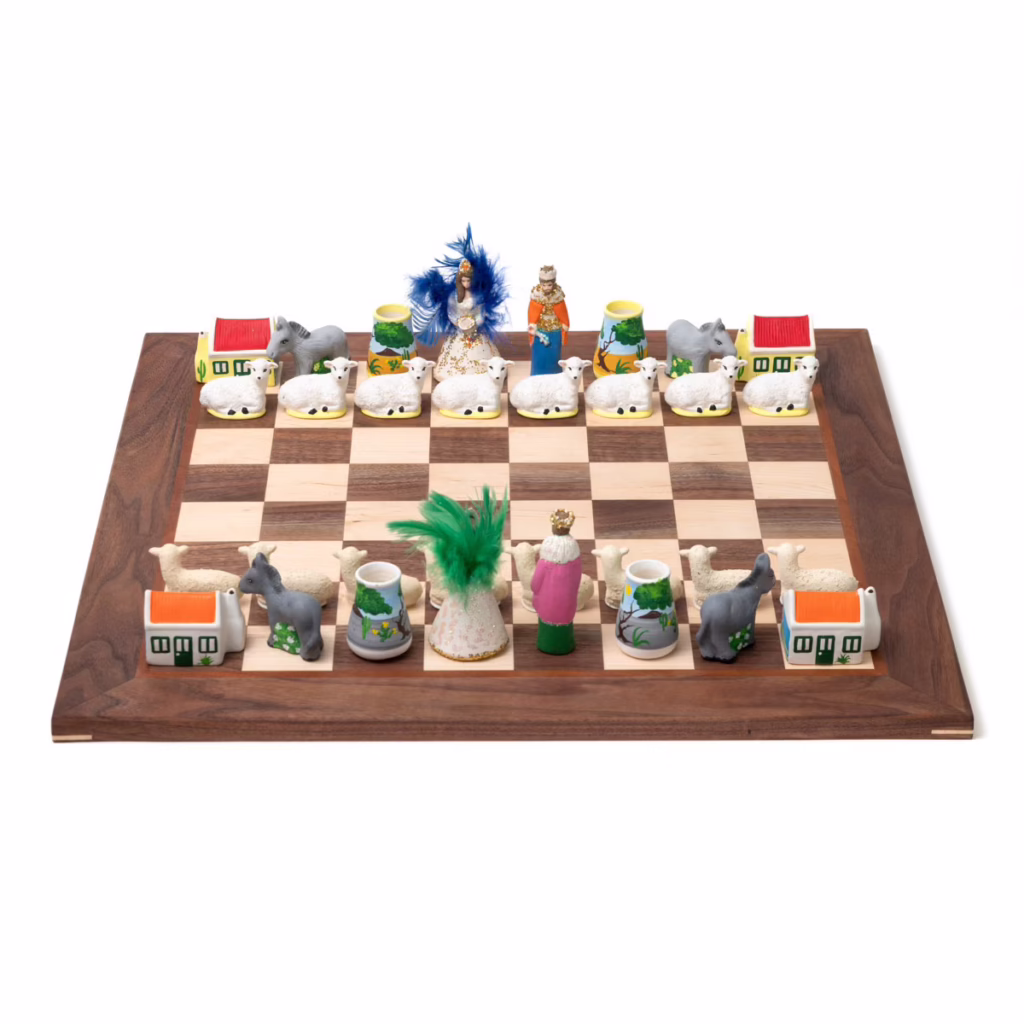Colorful Aruban chess set with pieces inspired by local Carnival traditions and Divi-Divi trees.