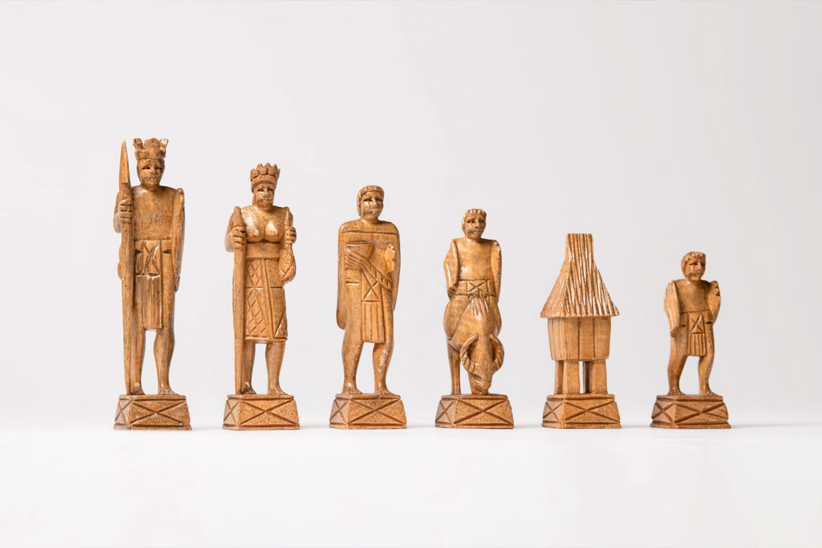 Full Igorot chess set with hand-carved mahogany and kamagong wood pieces representing indigenous Philippine tribal life.