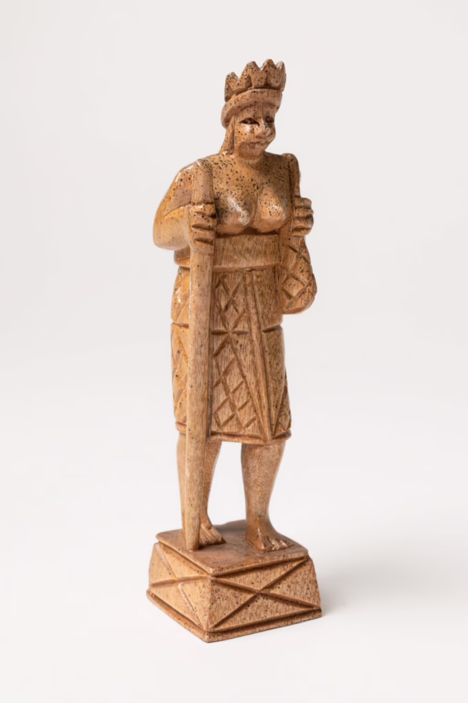 Detailed view of the queen piece depicting traditional hand-woven skirts from the Baguio people.