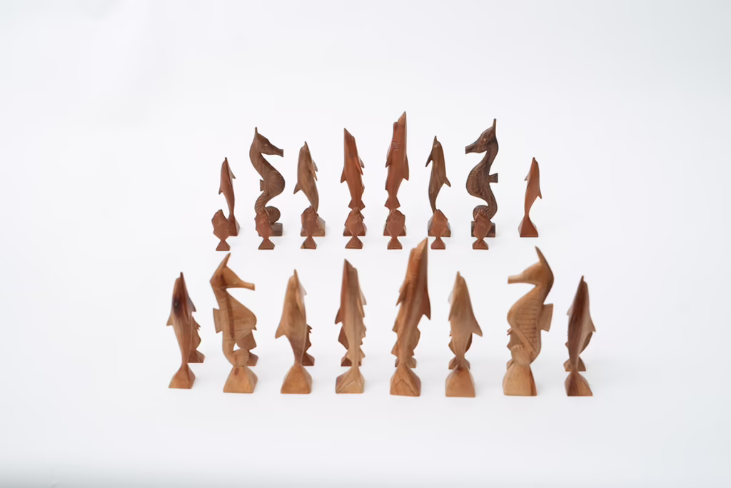 Carved sea life chess set from Kosrae, Micronesia depicting indigenous marine animals.